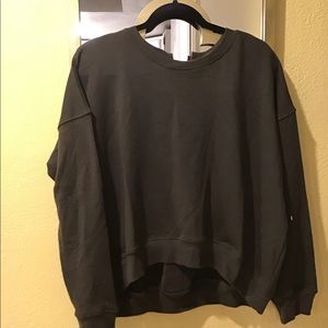 Sweater, olive green, white ties with in back.